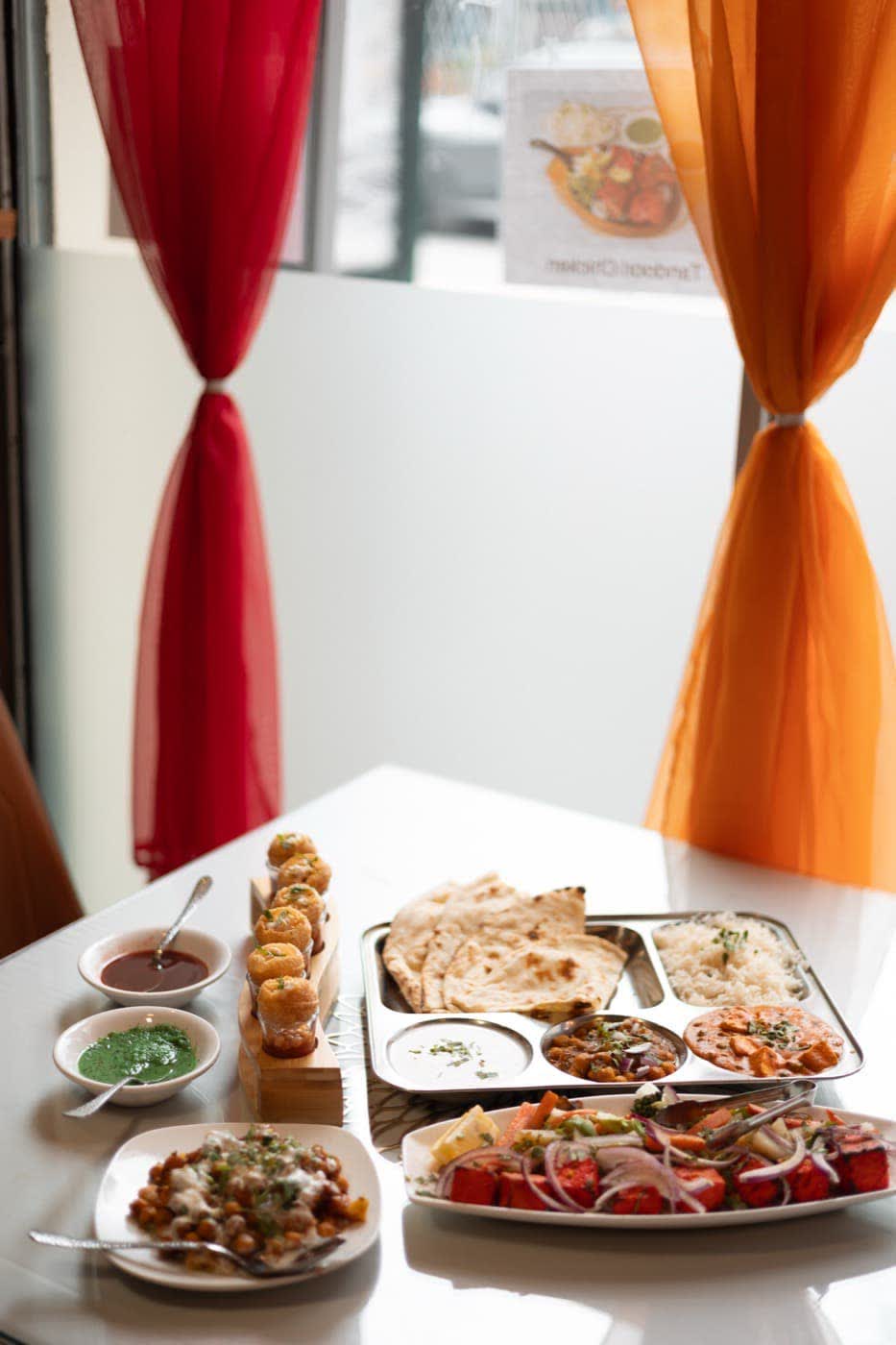 A full Indian thali spread with curries, rice and bread
